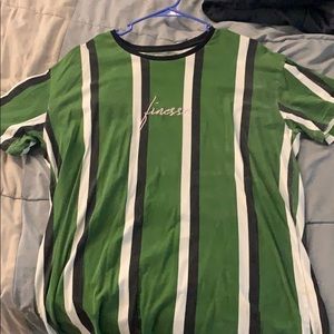 Green shirt w/ black and white stripes